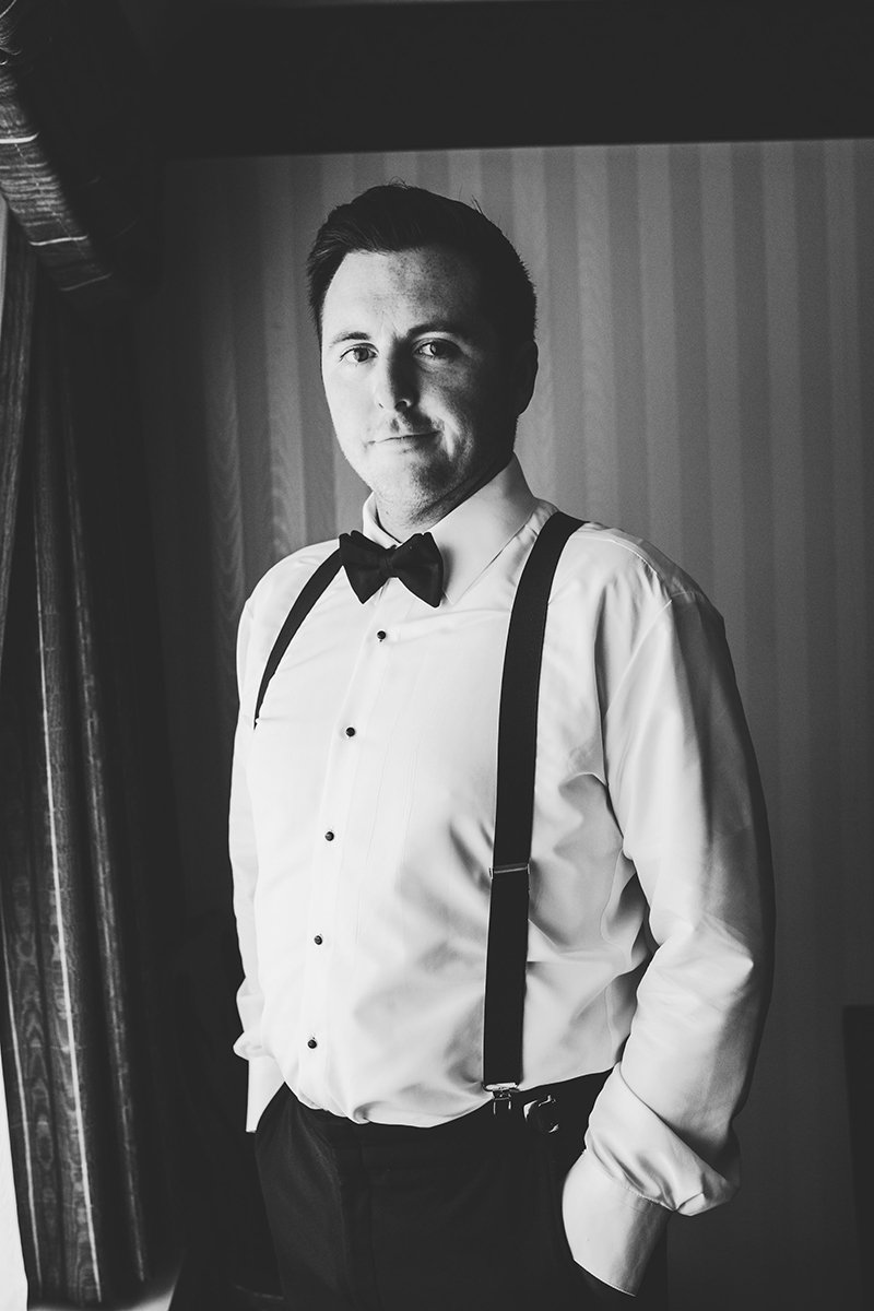 Black and white portrait of groom prior to the wedding
