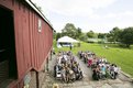High angle crowd photo of seated guests at outdoor barn wedding