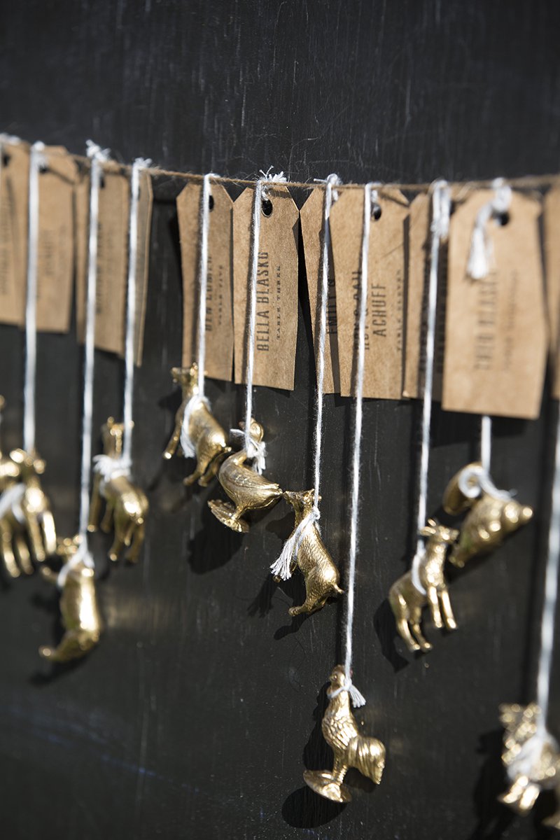Brass animal tokens used for table cards and wedding favors