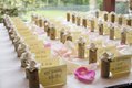 Wedding reception table cards featuring wine corks and flower petals