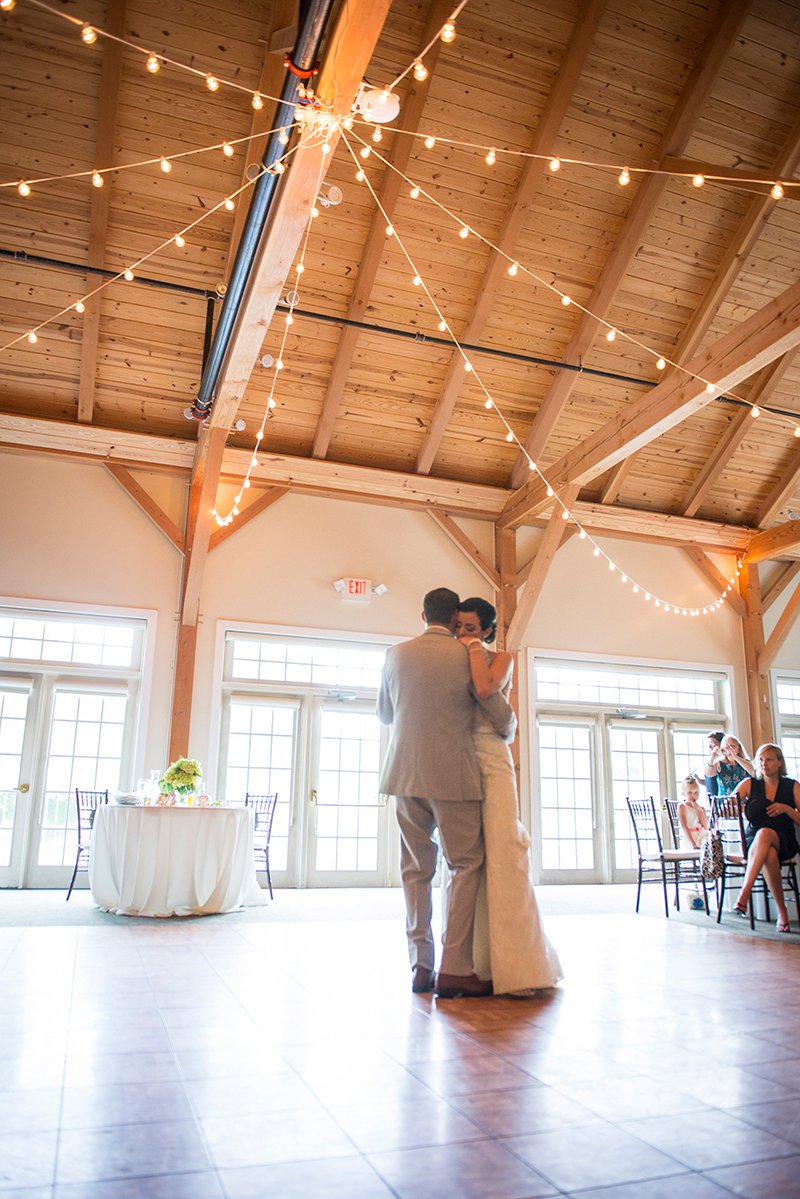Bride and groom's first dance, vaulted ceiling with string lights