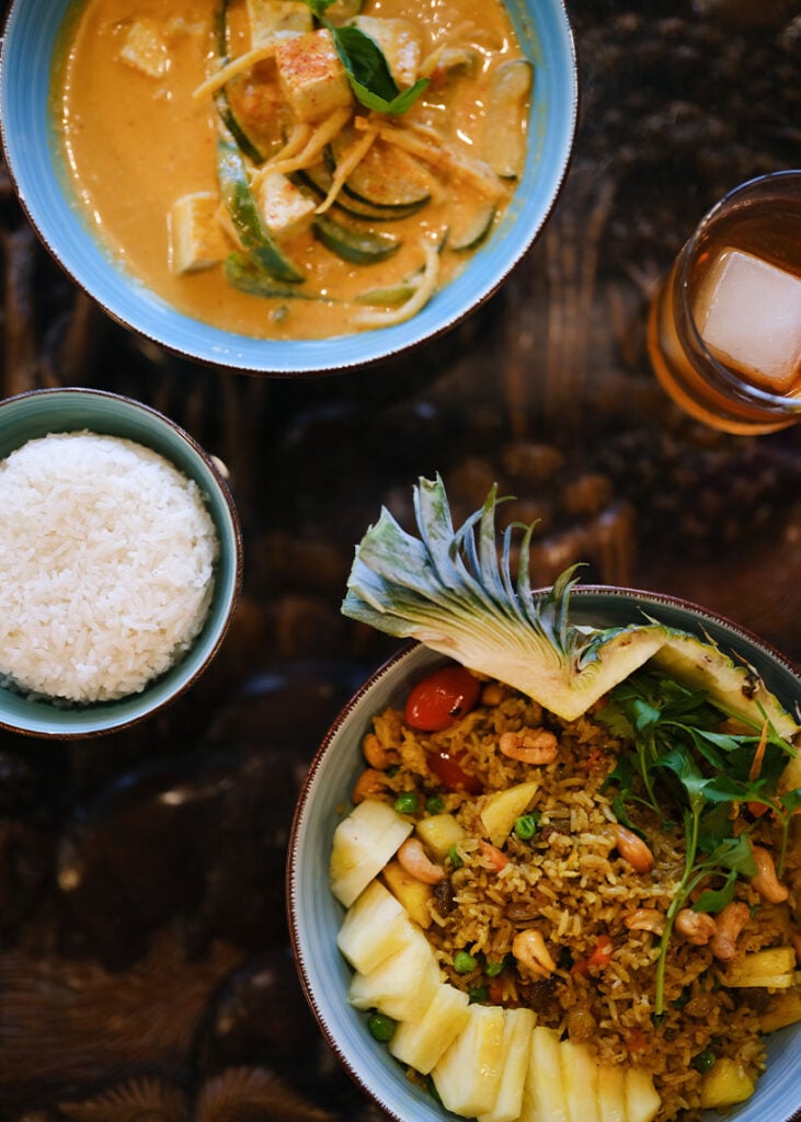 Pineapple fried rice and tofu curry at Little Orchids Kitchen & Bar