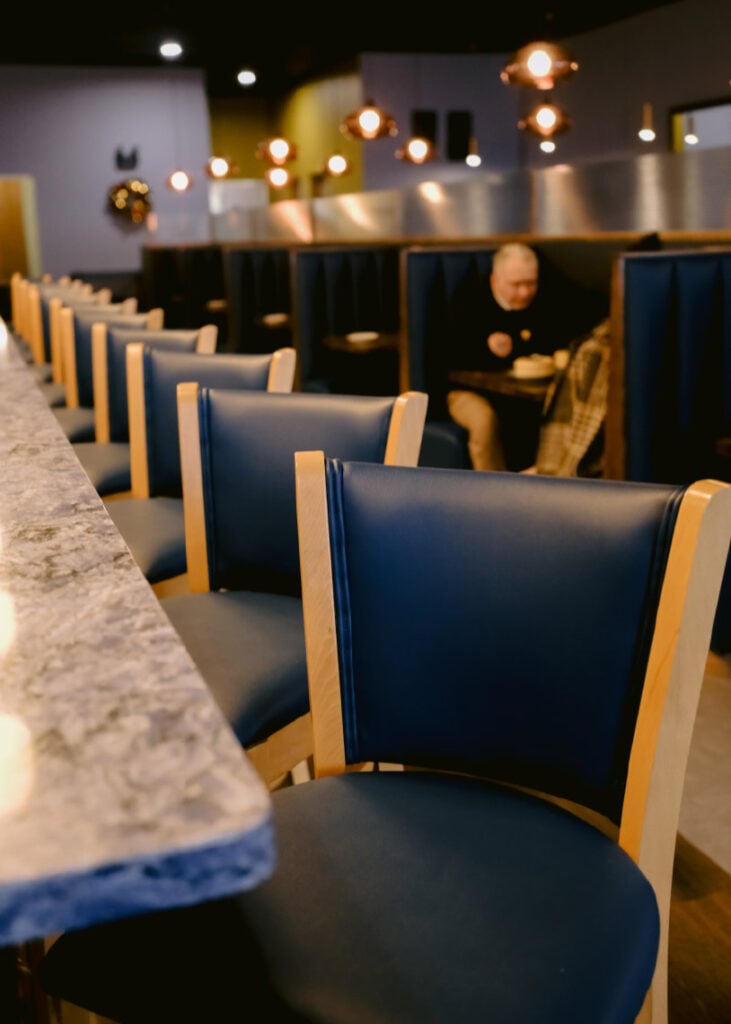 A row of barstools at Little Orchids Kitchen & Bar