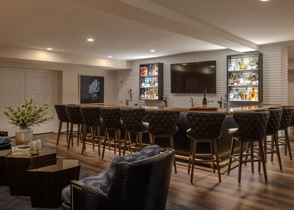 Barstools line a large bar top in an Upper Saucon house