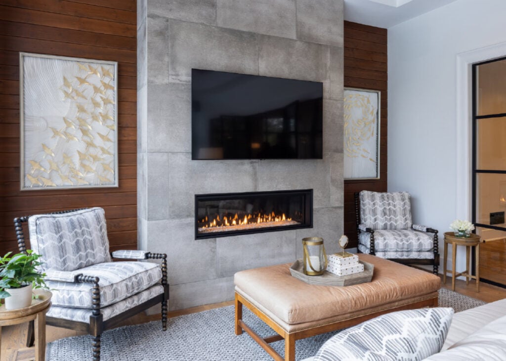 A fireplace in the four seasons room of an Upper Saucon house